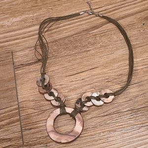 Polished shell and cord necklace